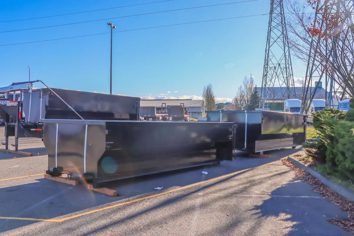 Roll-off dumpster ready for waste disposal at job site for 2 Yard Dumpster Rental in Port Clinton